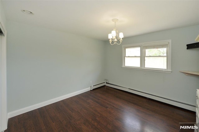 empty room featuring baseboards, a chandelier, dark wood-type flooring, and a baseboard radiator