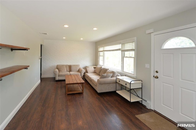 living room with visible vents, recessed lighting, dark wood-style flooring, and baseboards