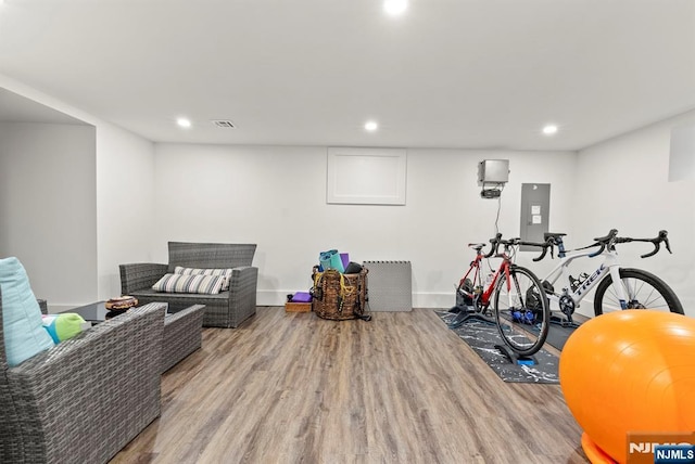 interior space featuring recessed lighting, wood finished floors, and visible vents