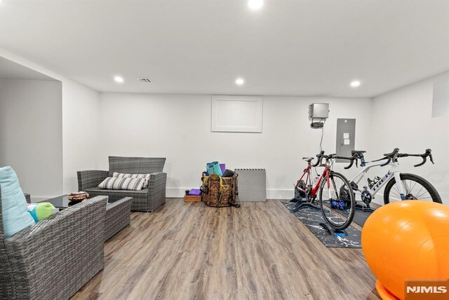 interior space with recessed lighting, visible vents, and wood finished floors