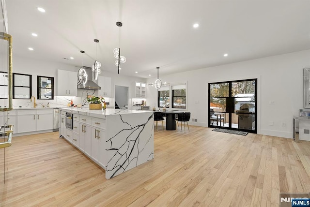 kitchen featuring light wood-style floors, recessed lighting, and a chandelier