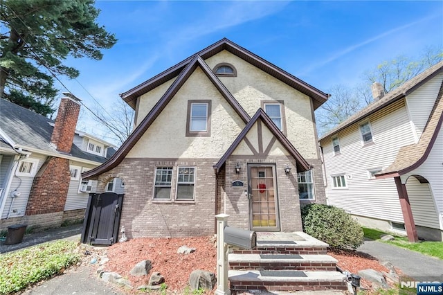 6 Colonial Ct, Dumont, NJ 07628 - tudor home featuring stucco siding and brick siding