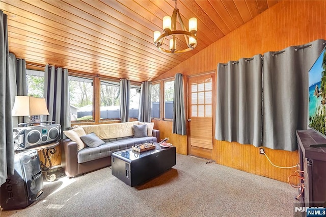 6 Colonial Ct, Dumont, NJ 07628 - carpeted living area featuring wooden walls, lofted ceiling, a notable chandelier, and wood ceiling