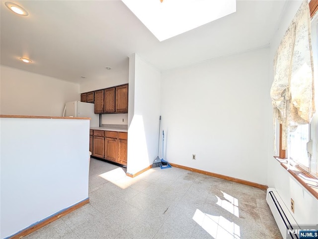 interior space with recessed lighting, baseboards, and a baseboard radiator
