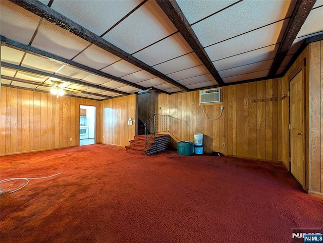 below grade area featuring wooden walls, carpet floors, stairway, and a wall mounted air conditioner