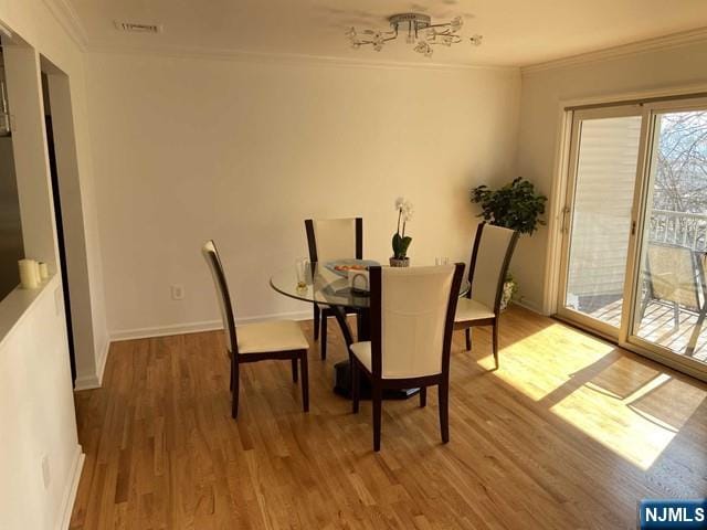 48 Legend Hills Dr, Edgewater, NJ 07020 - dining room featuring crown molding, baseboards, and wood finished floors