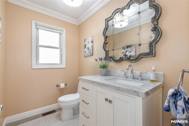 bathroom with visible vents, crown molding, vanity, baseboards, and toilet