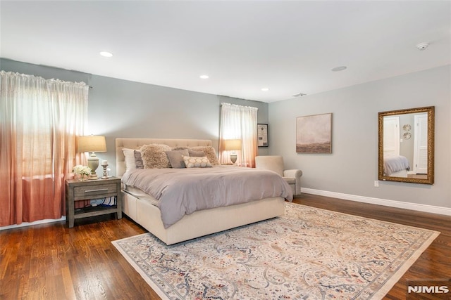 bedroom featuring baseboards, recessed lighting, dark wood-style flooring, and multiple windows