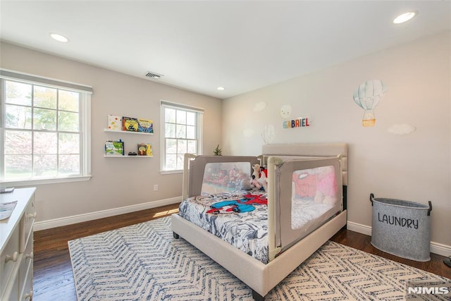 bedroom featuring recessed lighting, baseboards, visible vents, and wood finished floors