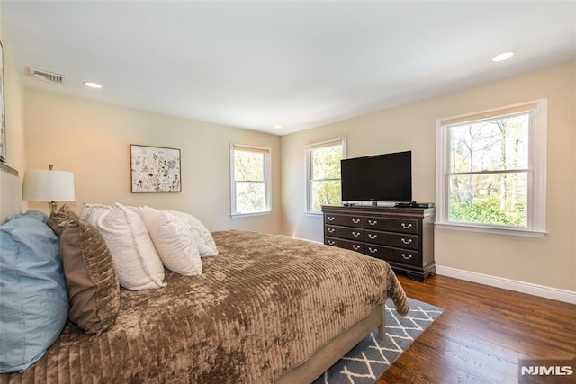 bedroom featuring recessed lighting, baseboards, visible vents, and dark wood finished floors