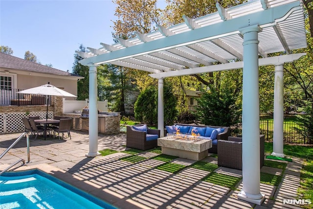 view of patio / terrace with an outdoor living space with a fire pit, fence, a pergola, area for grilling, and outdoor dining space
