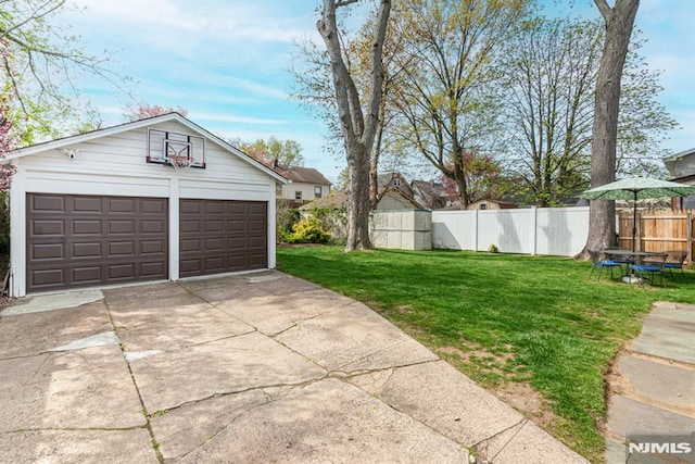 garage with fence