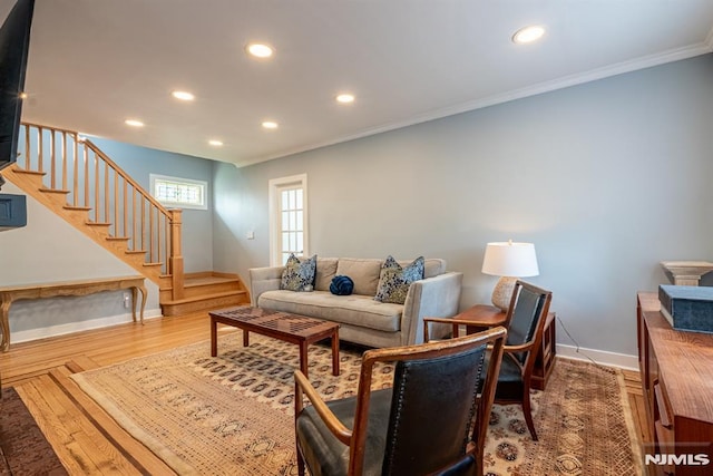 living room with stairs, recessed lighting, baseboards, and ornamental molding