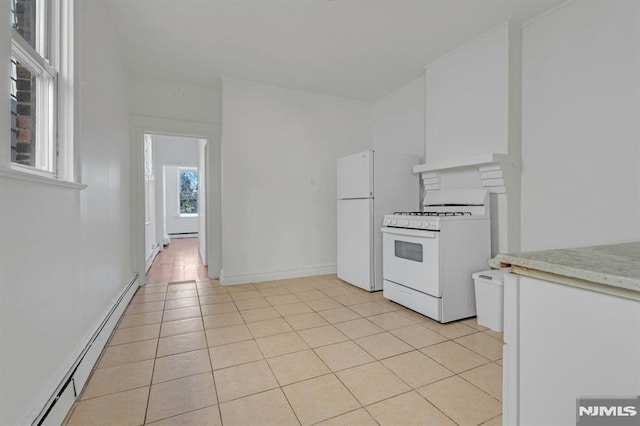 41 Heckel St, Belleville, NJ 07109 - kitchen with white cabinets, light tile patterned flooring, white appliances, light countertops, and a baseboard heating unit
