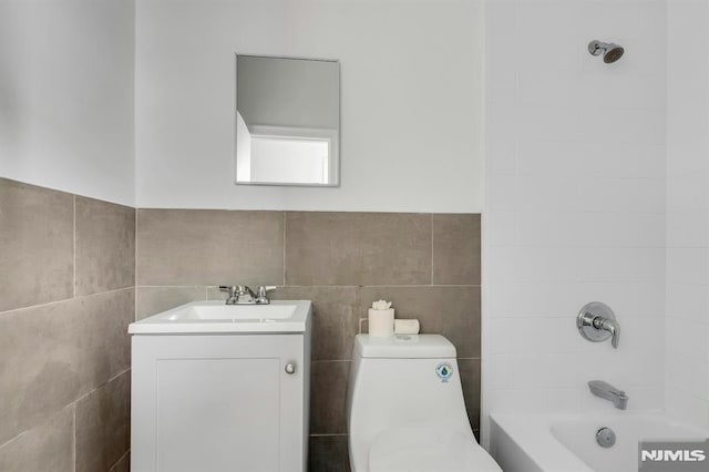 41 Heckel St, Belleville, NJ 07109 - full bath featuring vanity, bathtub / shower combination, toilet, and tile walls