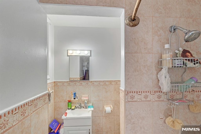 41 Heckel St, Belleville, NJ 07109 - bathroom featuring tile walls, a wainscoted wall, and vanity