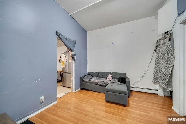 41 Heckel St, Belleville, NJ 07109 - living area featuring light wood-style floors, a baseboard radiator, and baseboards
