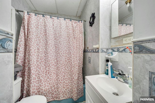 41 Heckel St, Belleville, NJ 07109 - bathroom with vanity, shower / bathtub combination with curtain, toilet, and tile walls