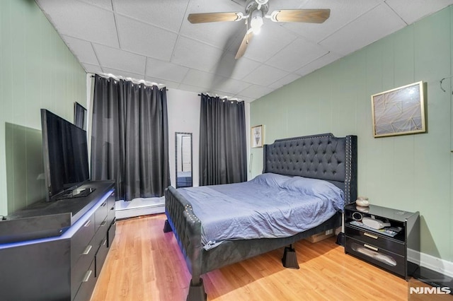 41 Heckel St, Belleville, NJ 07109 - bedroom featuring ceiling fan, a baseboard heating unit, and light wood finished floors
