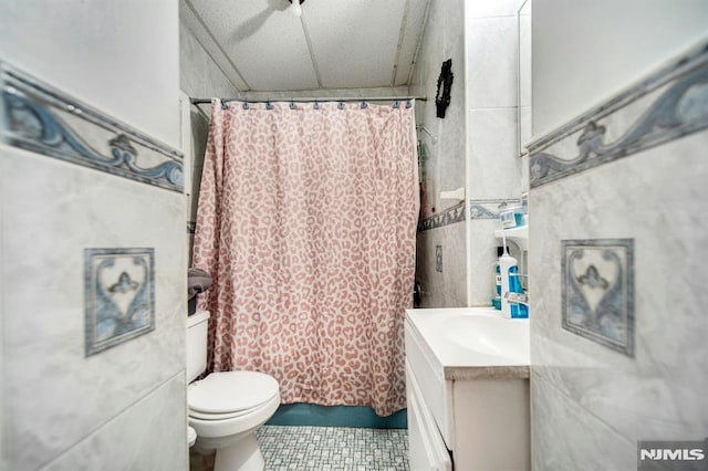41 Heckel St, Belleville, NJ 07109 - bathroom with tile walls, tile patterned flooring, vanity, and toilet