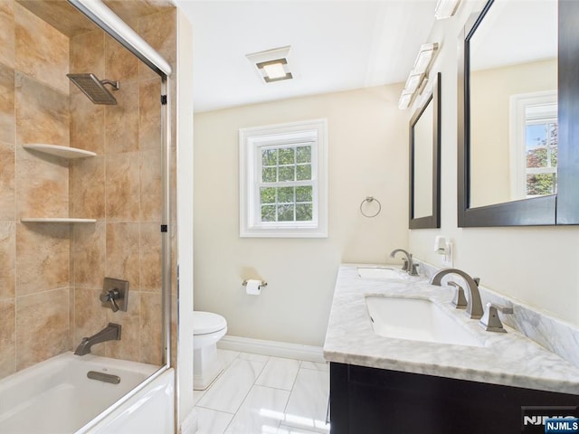 full bathroom featuring a sink, baseboards, toilet, and marble finish floor