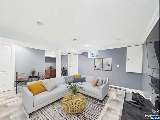 living area featuring recessed lighting, visible vents, ornamental molding, and light wood finished floors