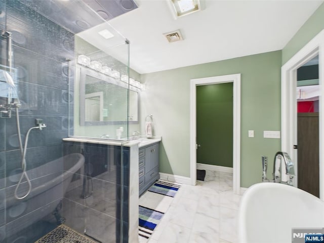 full bathroom featuring visible vents, vanity, marble finish floor, baseboards, and a stall shower
