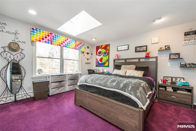 bedroom featuring a skylight, carpet floors, baseboard heating, and recessed lighting