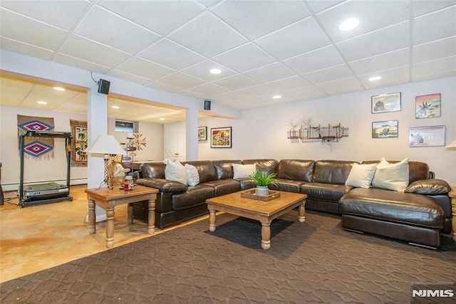 living room featuring recessed lighting and a drop ceiling