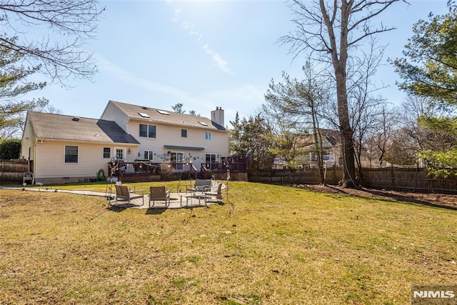 view of yard with a fenced backyard, a patio, and a deck
