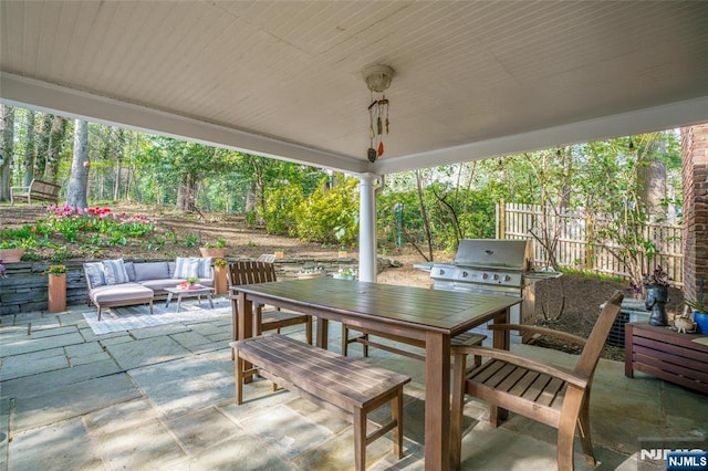 view of patio with outdoor lounge area, fence, and outdoor dining space