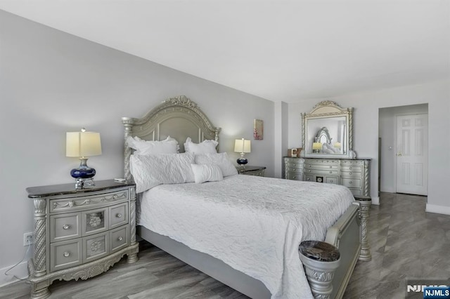bedroom featuring baseboards