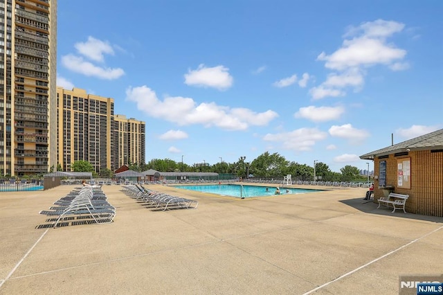 community pool featuring a patio area