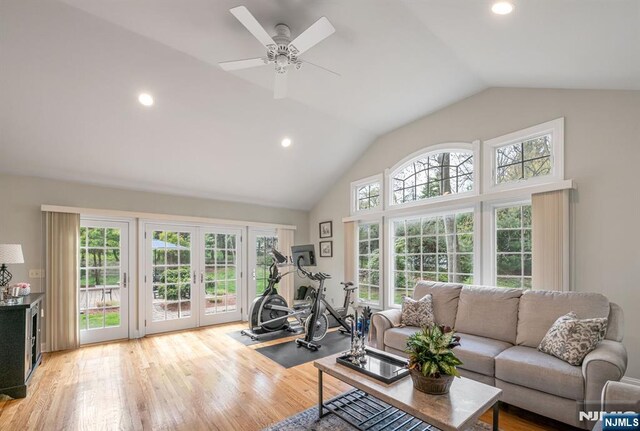 exercise area with a ceiling fan, french doors, recessed lighting, and light wood-style flooring