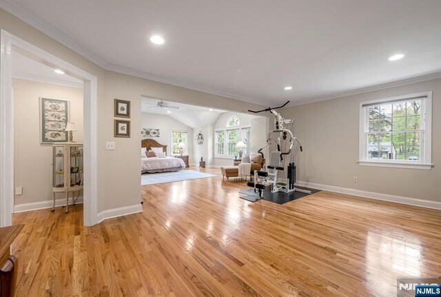 workout room with recessed lighting, baseboards, light wood-type flooring, and lofted ceiling