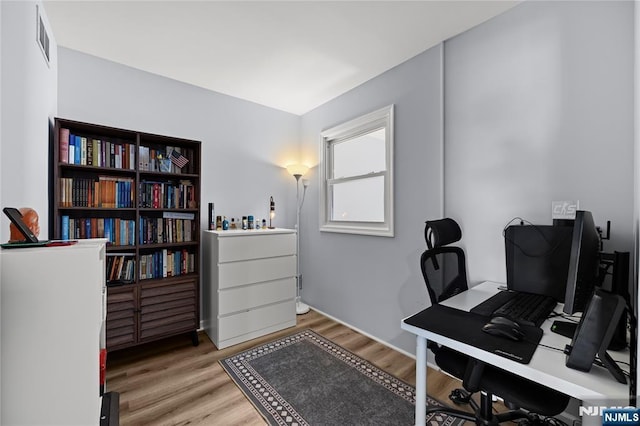 office with visible vents and light wood-style flooring