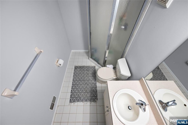 full bath featuring visible vents, an enclosed shower, tile patterned flooring, vanity, and toilet