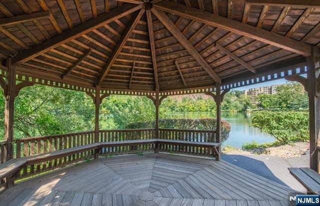 deck featuring a water view and a gazebo