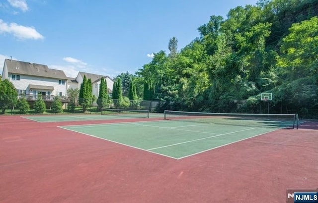 view of sport court with community basketball court and fence