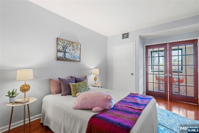 bedroom featuring french doors, baseboards, access to outside, and hardwood / wood-style flooring