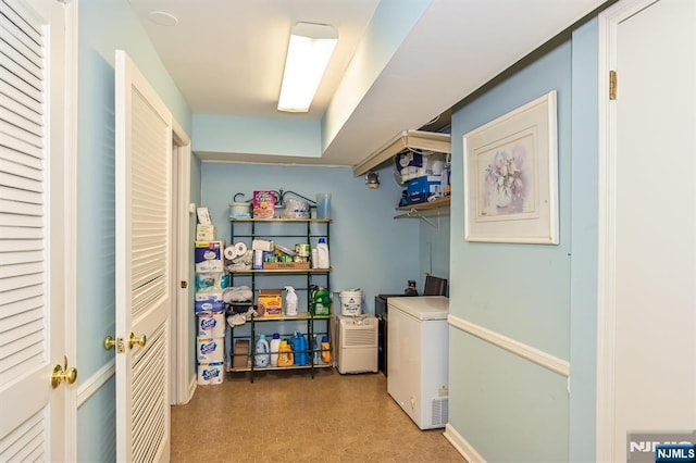 laundry area featuring laundry area and tile patterned floors
