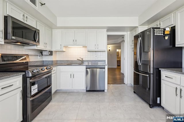 kitchen featuring white cabinetry and stainless steel appliances