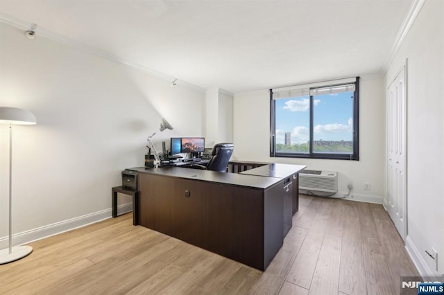 home office featuring crown molding, baseboards, a wall unit AC, and light wood-style flooring