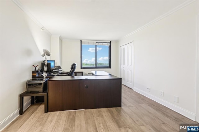 office area with crown molding, baseboards, and light wood finished floors