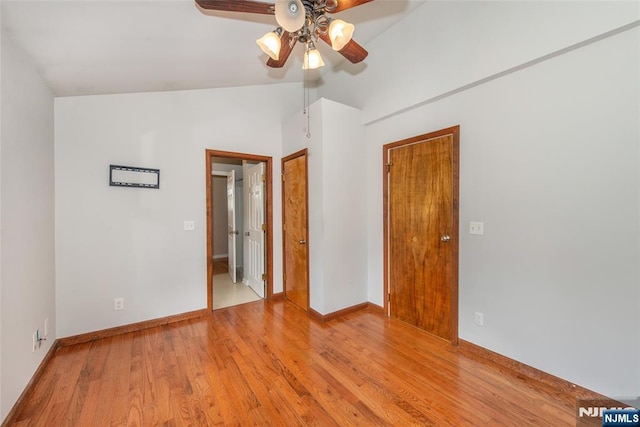 516 5th St, Carlstadt, NJ 07072 - unfurnished bedroom with light wood-style floors, baseboards, a ceiling fan, and vaulted ceiling