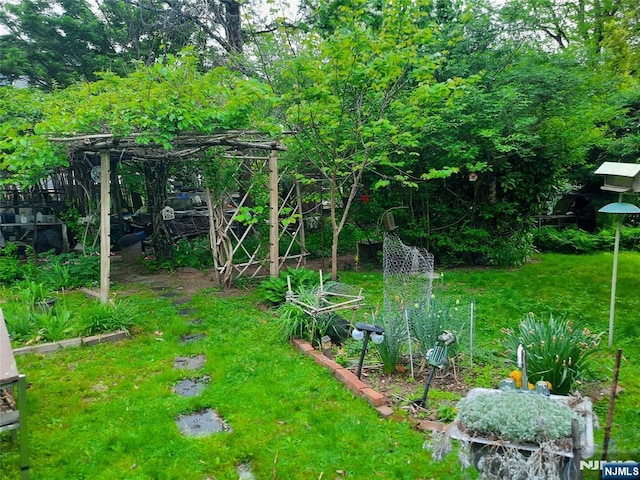 307 Phelps Ave, Bergenfield, NJ 07621 - view of yard featuring a garden