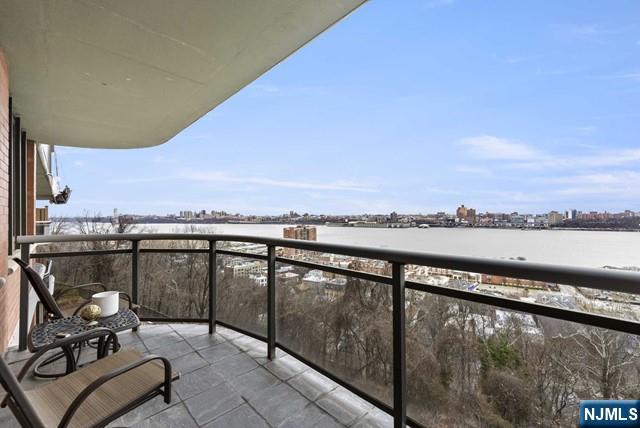 balcony featuring a sunroom