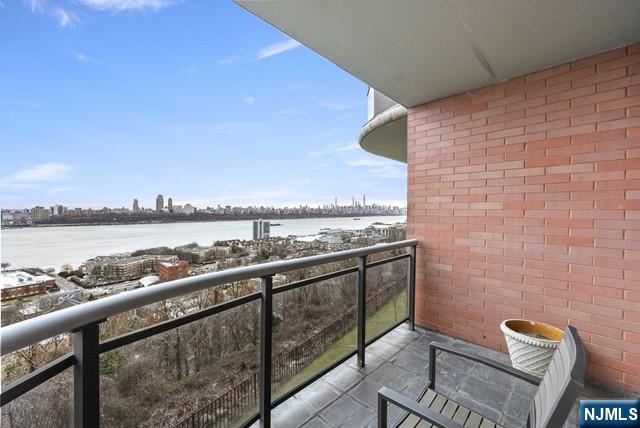balcony featuring a water view