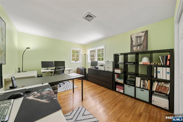 office area featuring visible vents and hardwood / wood-style flooring