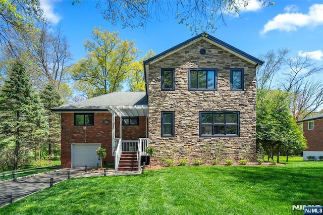 view of front facade featuring a garage, concrete driveway, a front yard, and stone siding